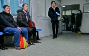 People wait outside the CT rooms. 