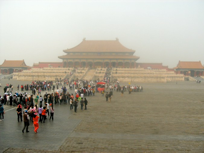 People tour the Forbidden City on a polluted day in September 2011. 