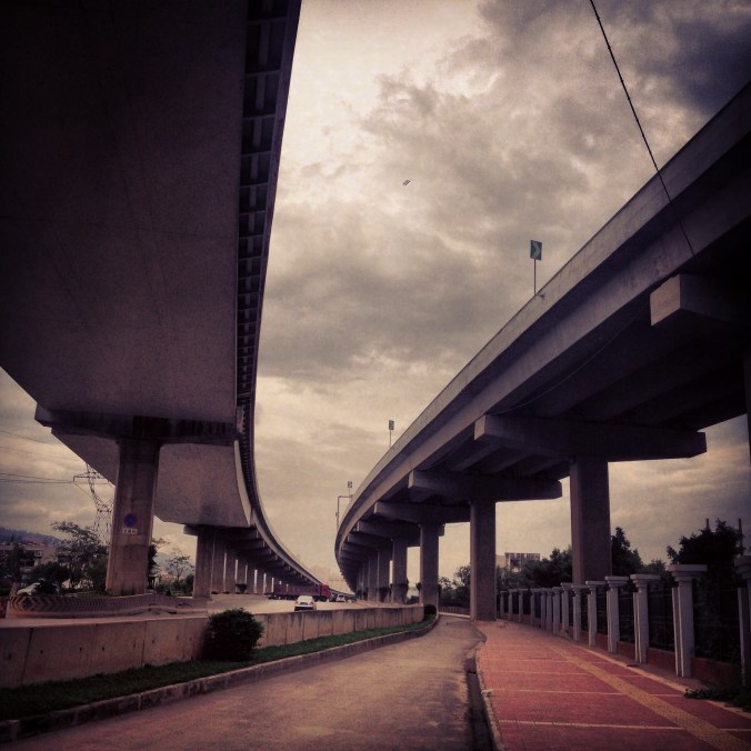 I rented a bike in Kunming and rode out into the countryside. The route under this overpass was pretty dangerous, with large trucks carrying steel pipes, coal and large vehicles sometimes cutting through the bike lane.