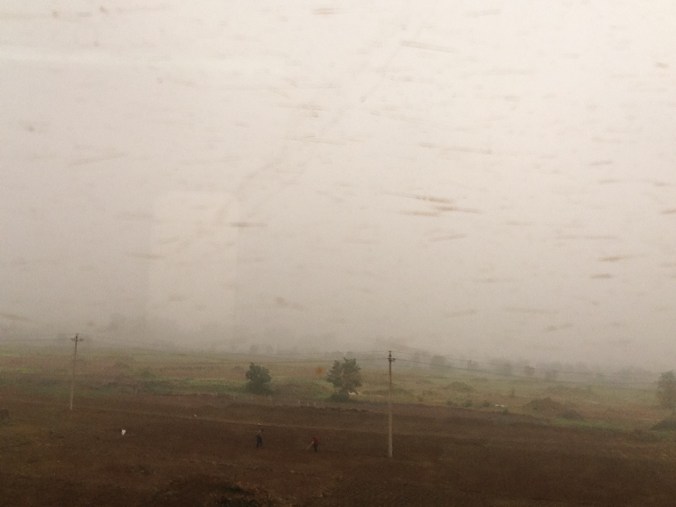 View of suburban Beijing from a subway car. Some scientists have labeled the city as "unlivable" because of the poor air quality.