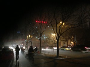 At night, the air pollution, illuminated by street and car lights, resembled a thick fog.